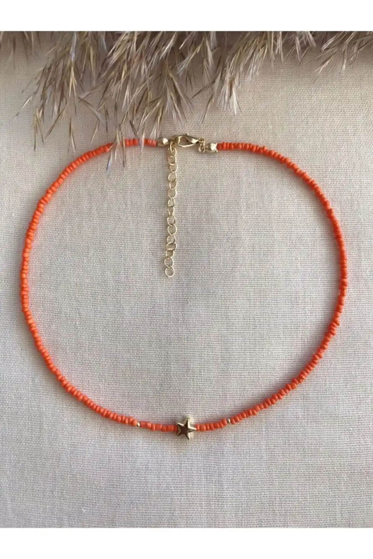 Turuncu Yıldızlı Uçlu Kolye: Gençler ve Stil Sahipleri İçin Enerjik Aksesuar Seçeneği