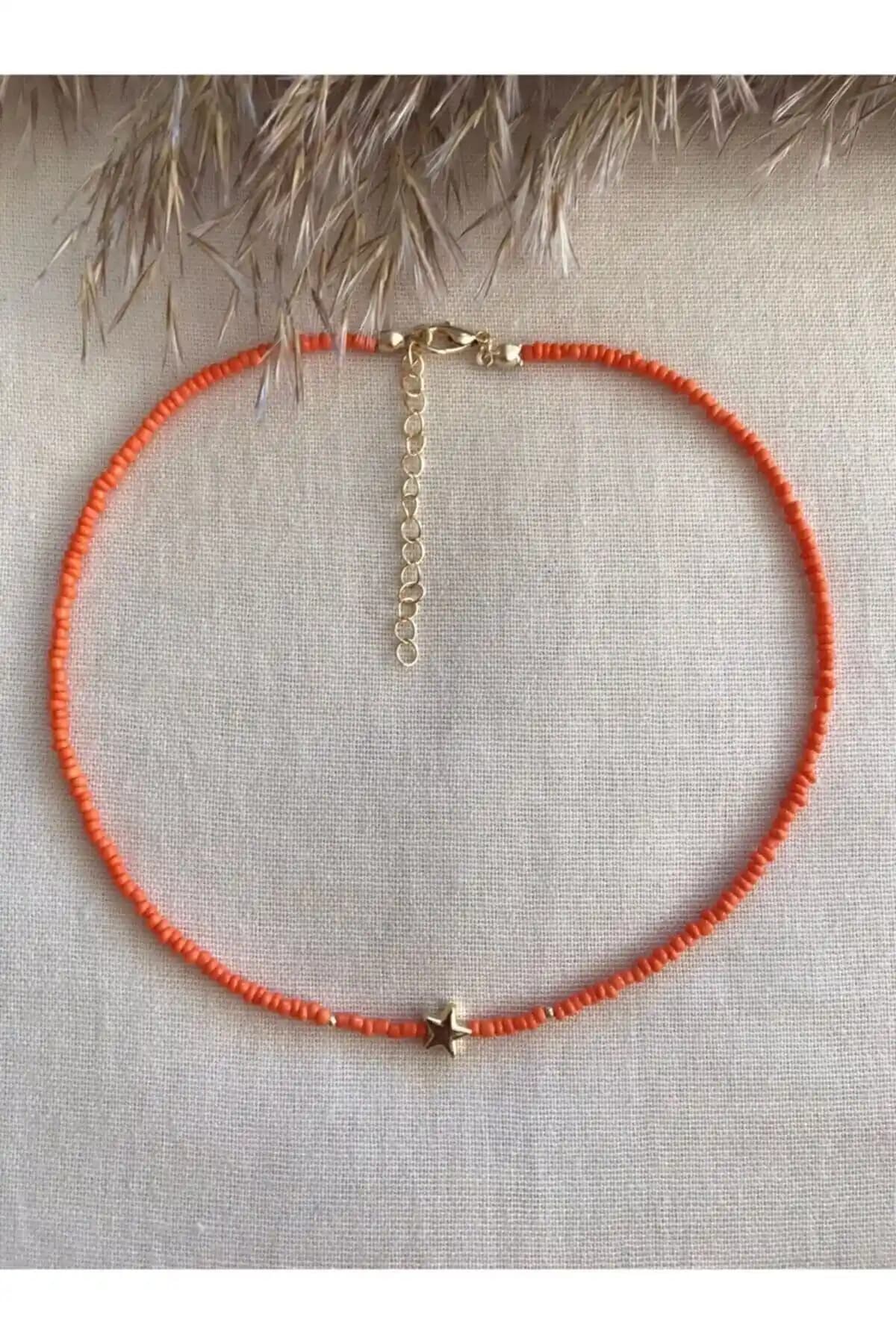 Turuncu Yıldızlı Uçlu Kolye: Gençler ve Stil Sahipleri İçin Enerjik Aksesuar Seçeneği