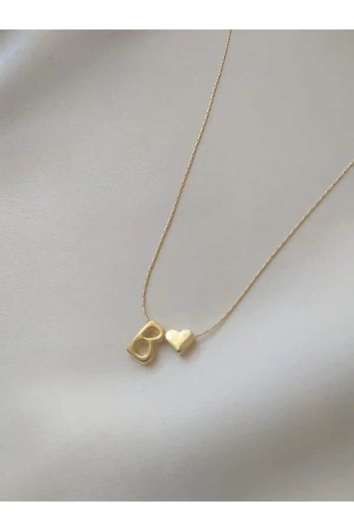 Asia by Leuvoié ve Claritas Takı B Harfli Kolye Karşılaştırması