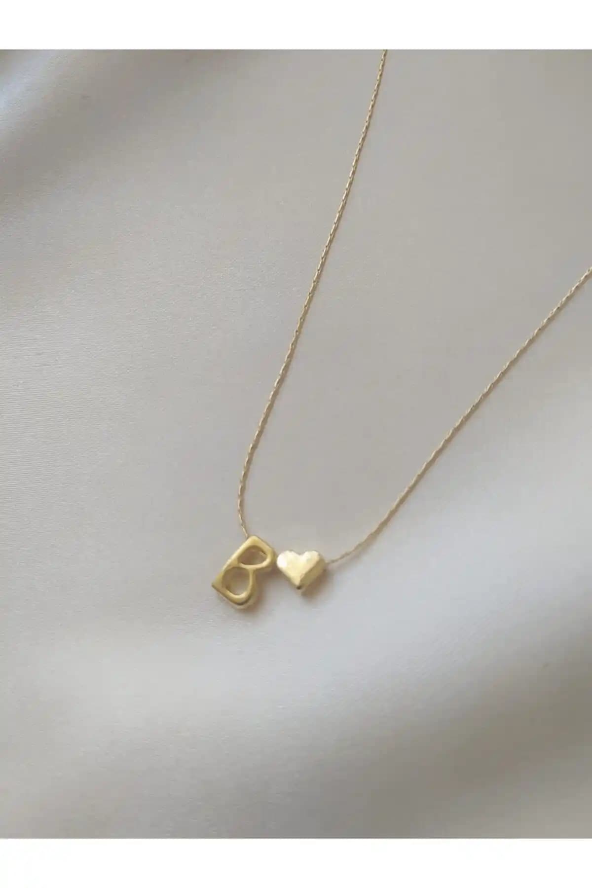 Asia by Leuvoié ve Claritas Takı B Harfli Kolye Karşılaştırması