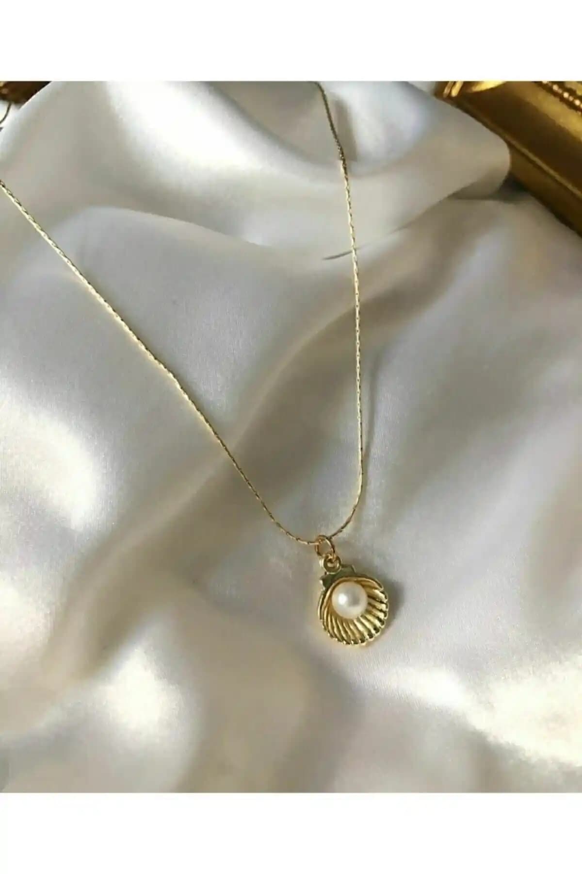 Asia Chic Incili Deniz Kabuğu ve OK ROSES Göz Desenli Kalp Kolyesi Karşılaştırması