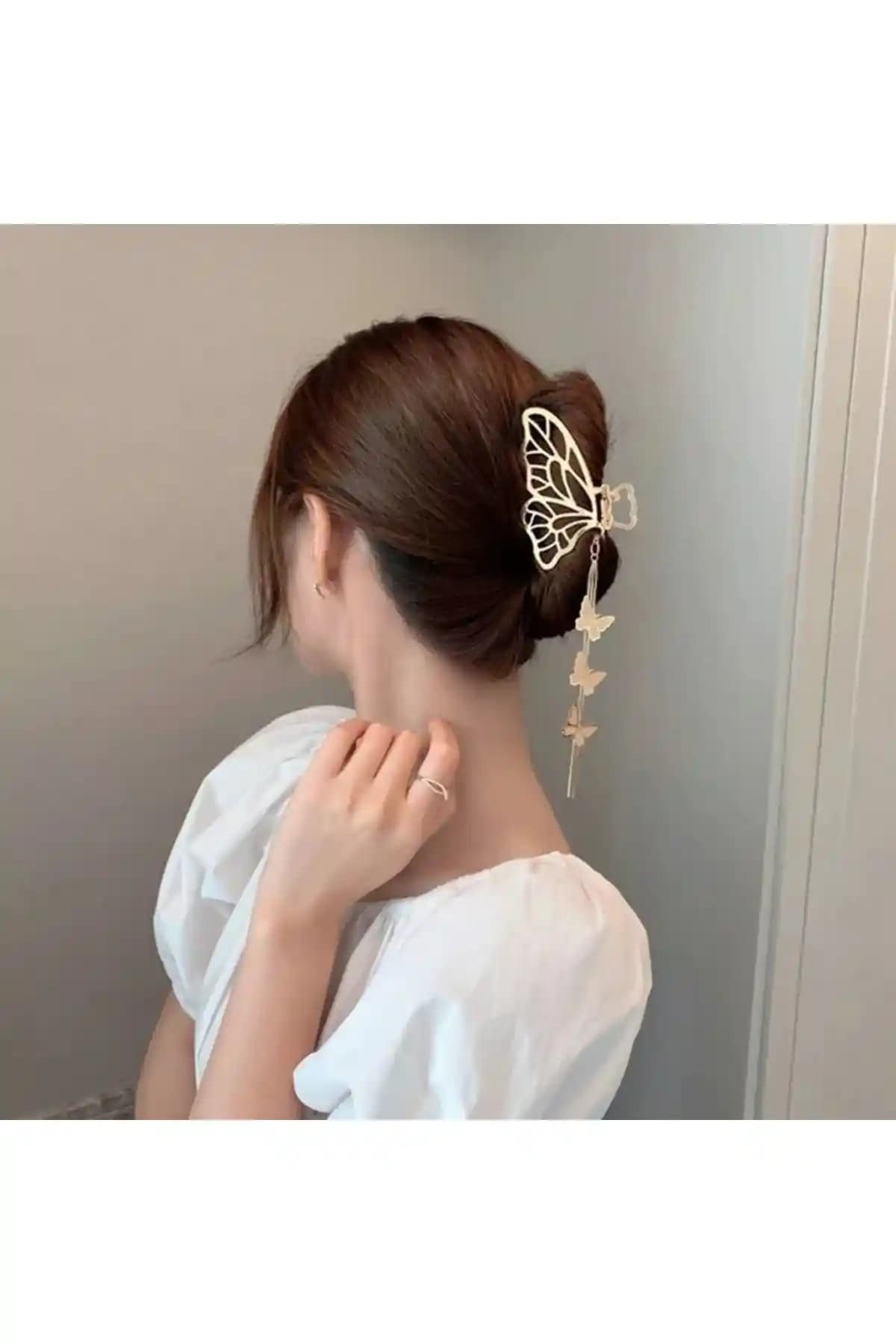 Gülpeşe Kelebek Sallantı Tokası: Altın Renk ve Animal Desen Detaylarıyla Şıklık